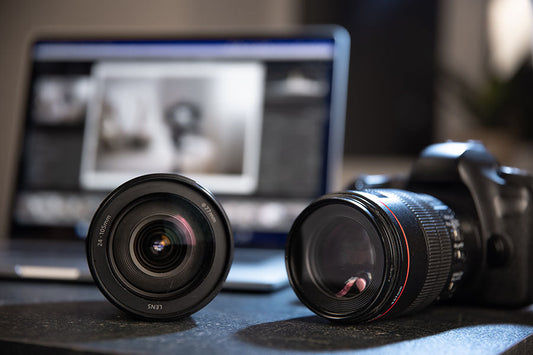Digital camera lenses displayed for resale at PayMore Reston
